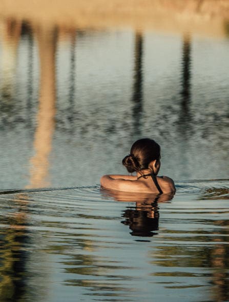a woman in a pool of water