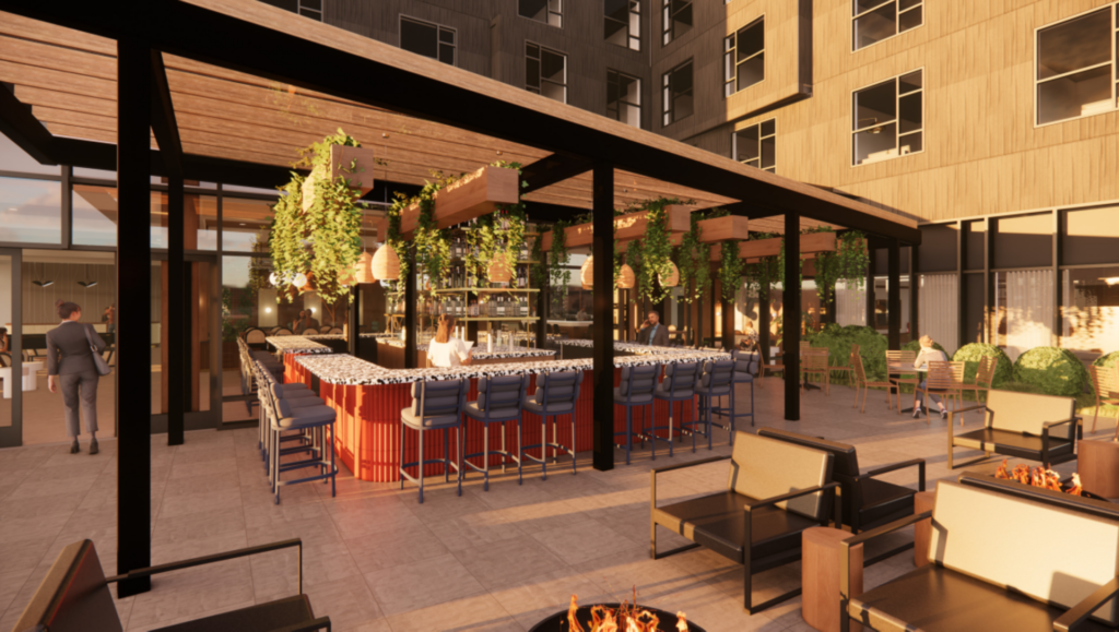 a patio with a bar and chairs