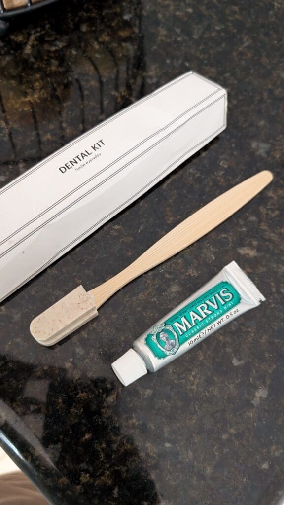 a toothbrush and toothpaste on a counter