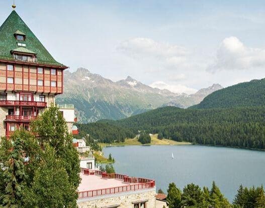 a building next to a lake