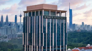 a tall building with a city in the background