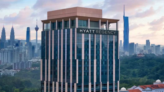 a tall building with a city in the background