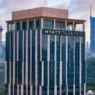 a tall building with a city in the background