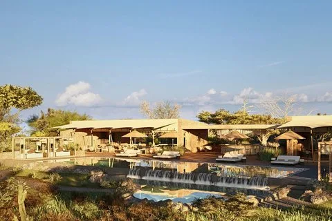 a building with a pool and a waterfall