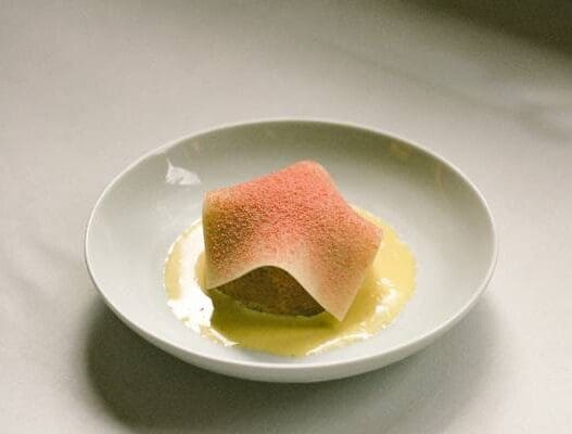 a plate of food with a piece of food on it