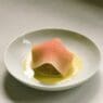 a plate of food with a piece of food on it
