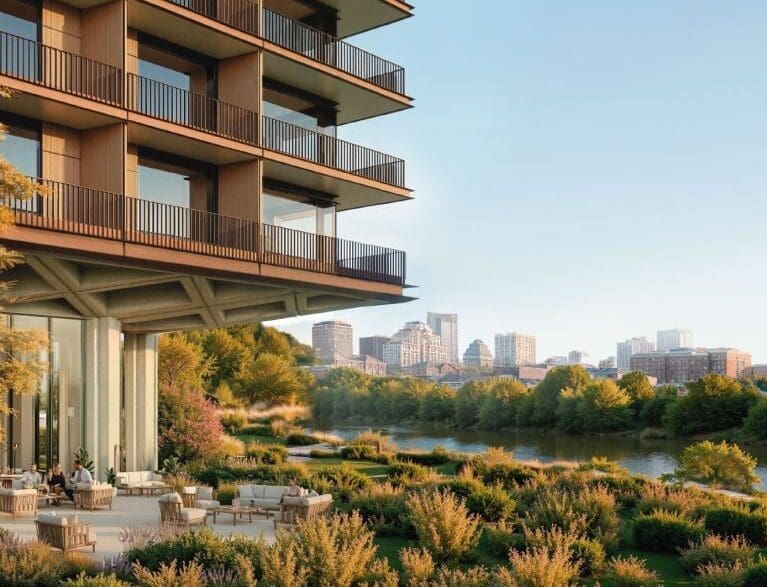 a building with a river and trees
