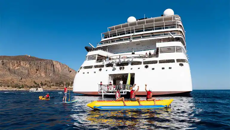 a group of people on a boat in the water