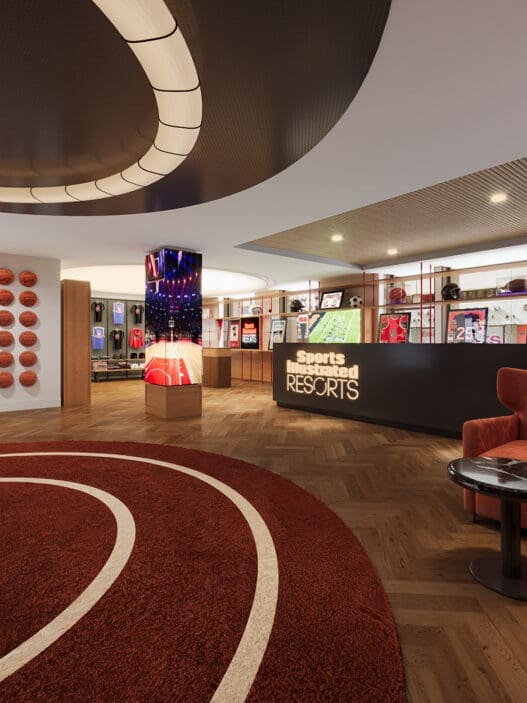 a sports store with a red rug and a red chair