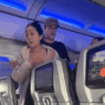 a woman standing in a plane