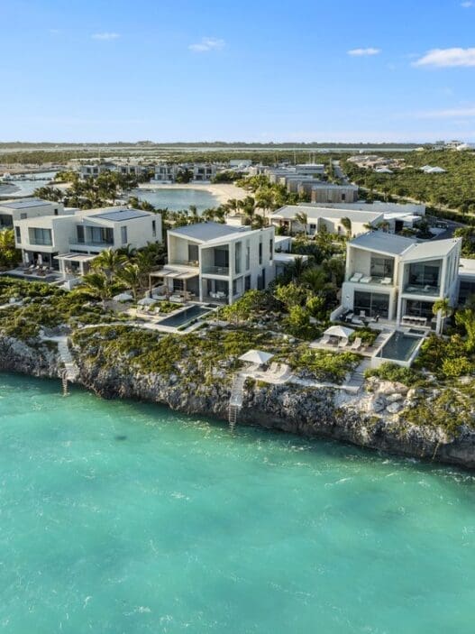a group of houses on a rocky island