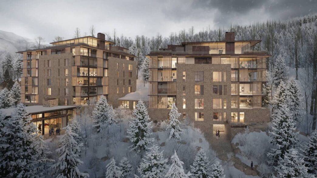 a group of buildings with snow covered trees