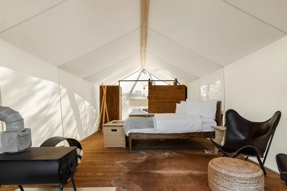 a room with a bed and a chair