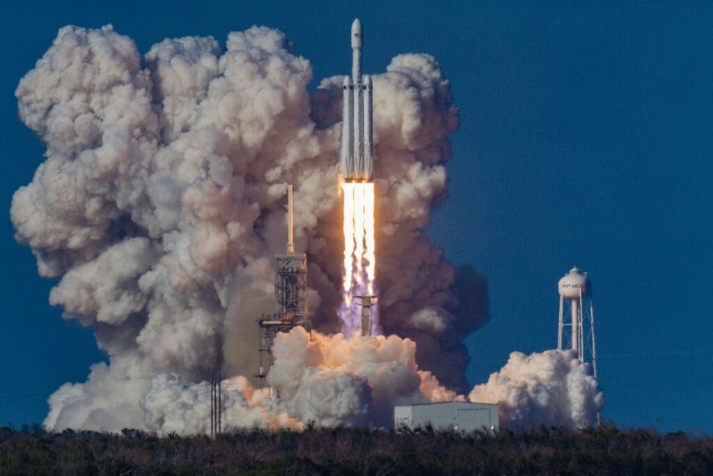 a rocket launching with smoke and clouds of smoke