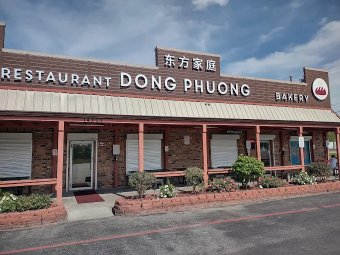 a brick building with a sign on the front