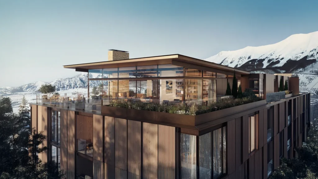 a building with a balcony and a mountain range in the background