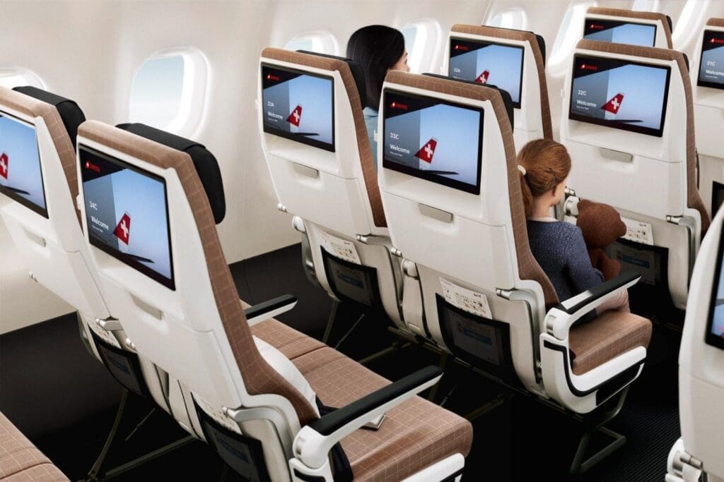 a group of people sitting in an airplane