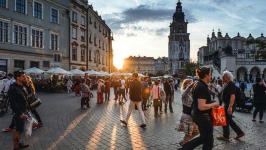 a group of people walking on a street