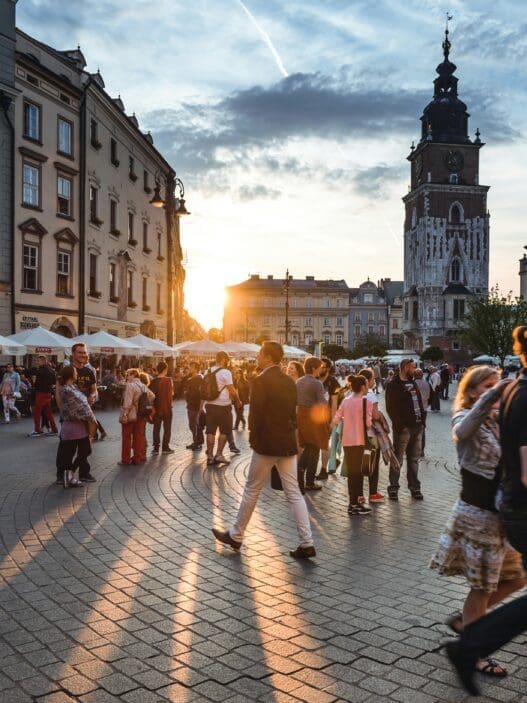 a group of people walking on a street