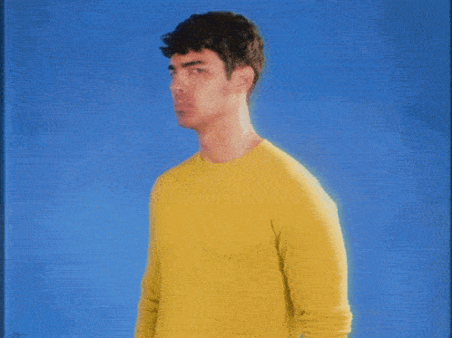 a man in a yellow shirt
