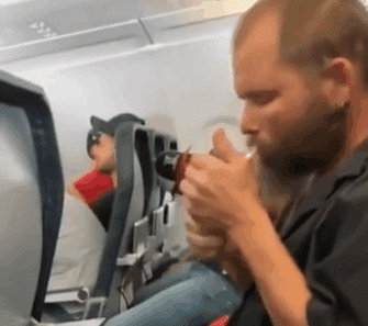 a man sitting in an airplane