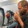 a man sitting in an airplane