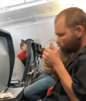 a man sitting in an airplane