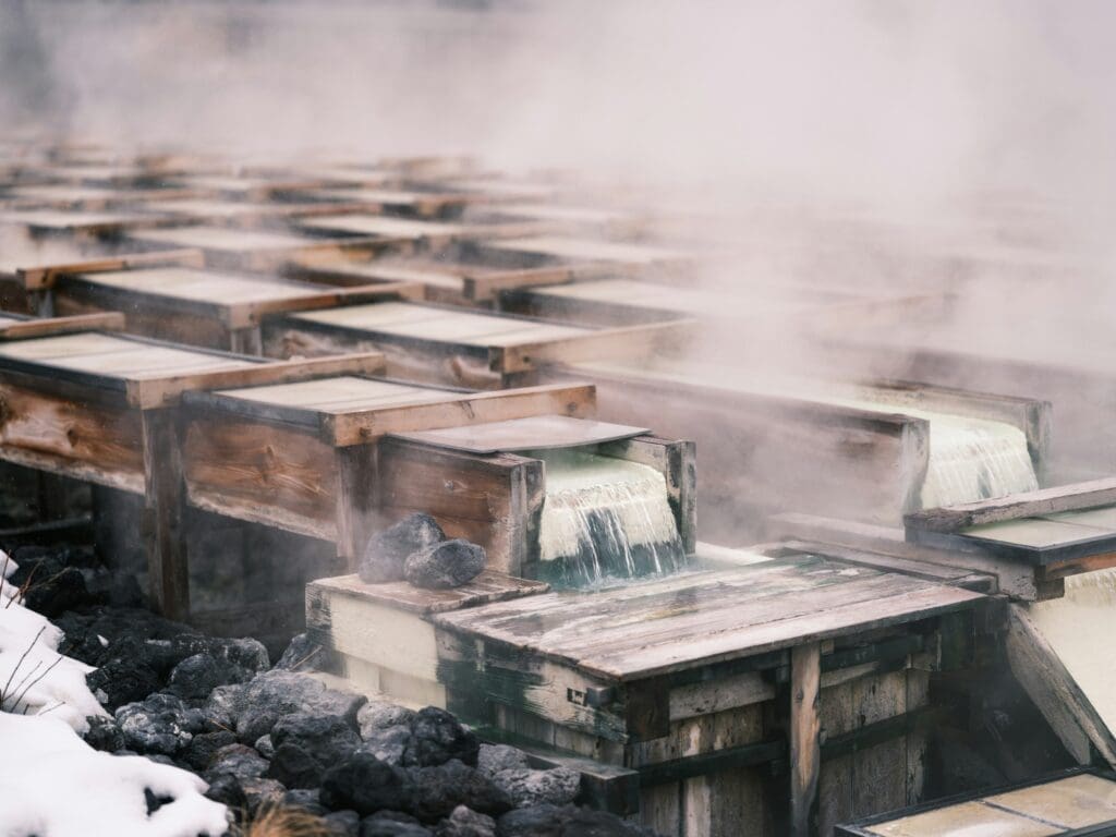 a group of wooden boxes with steam coming out of them