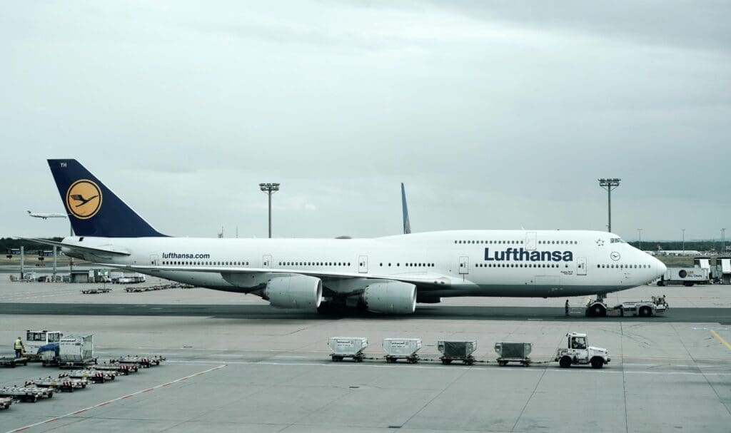 a large white airplane on a runway