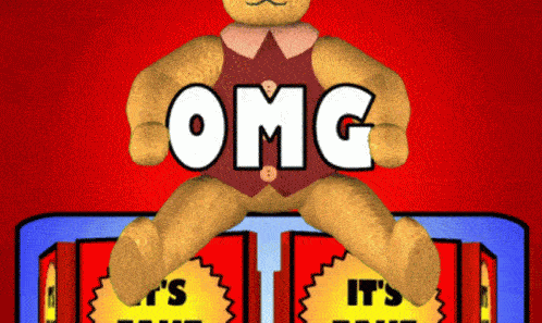 a teddy bear sitting on a red box