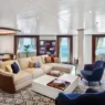 a room with a couch and chairs