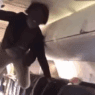 a person from the ceiling of an airplane