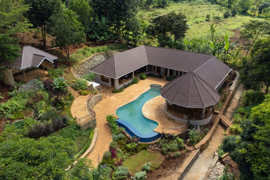 a house with a pool and trees