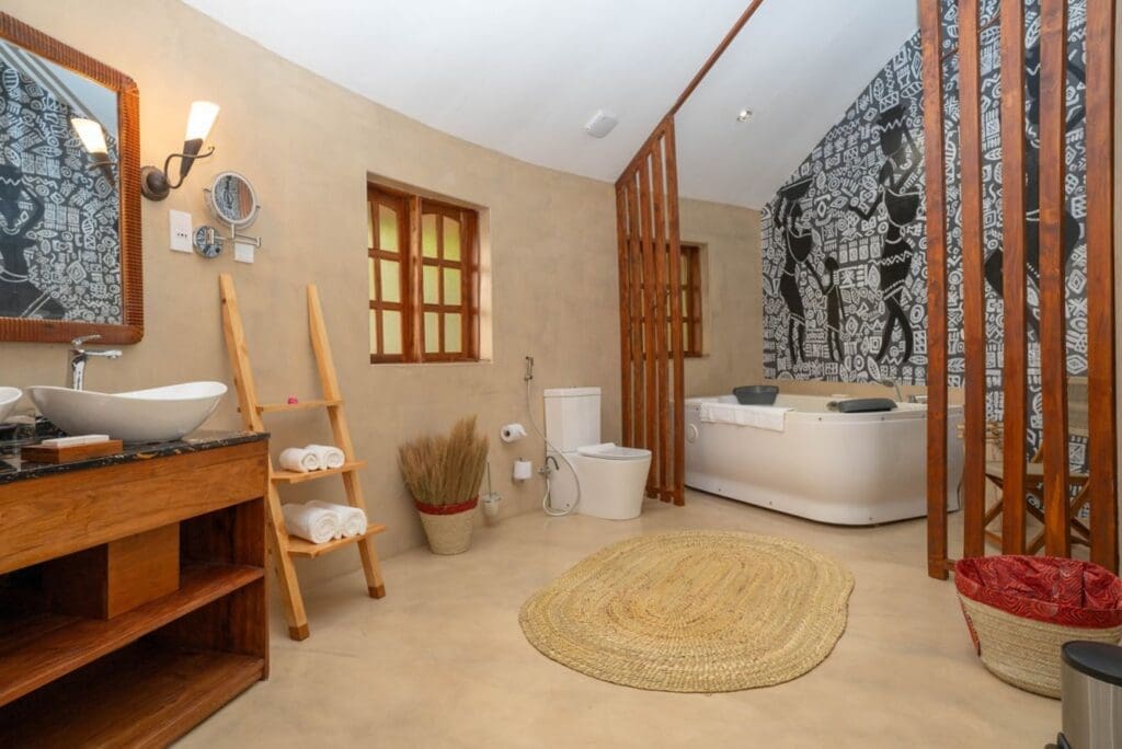 a bathroom with a tub and a toilet