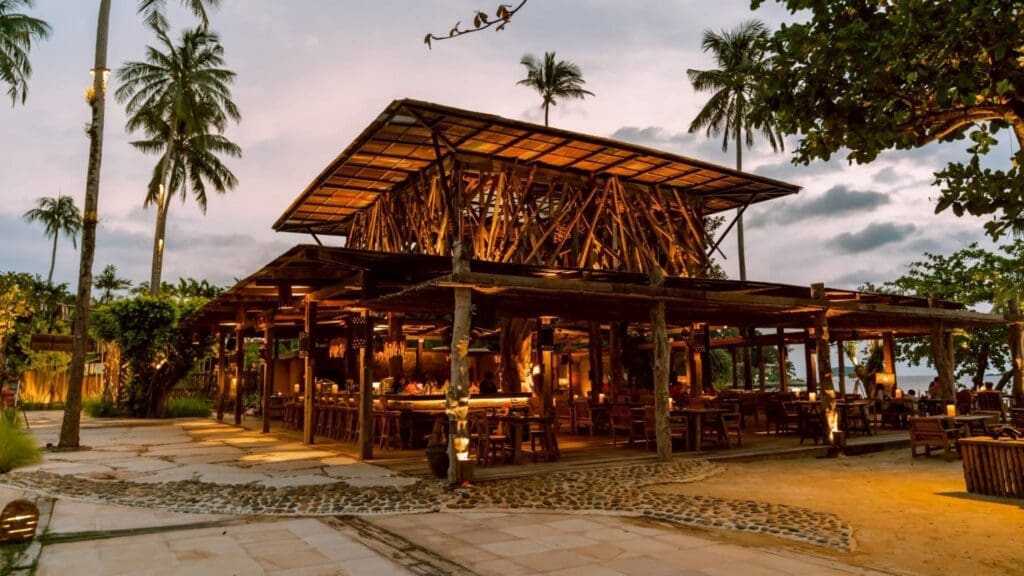 a building with a roof and tables and chairs