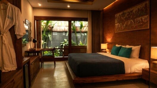 a bedroom with a bed and a desk