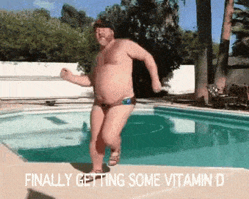 a man jumping into a pool