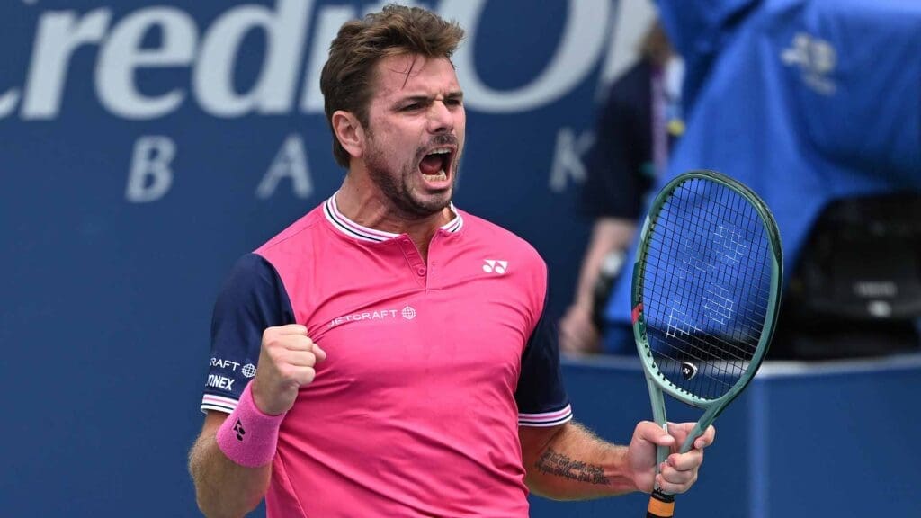 a man holding a tennis racket