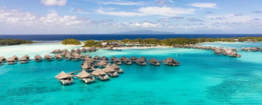 a group of huts on water