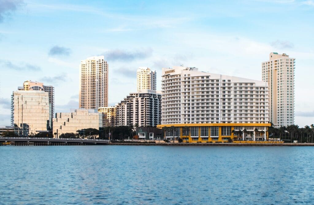 a body of water with buildings and trees