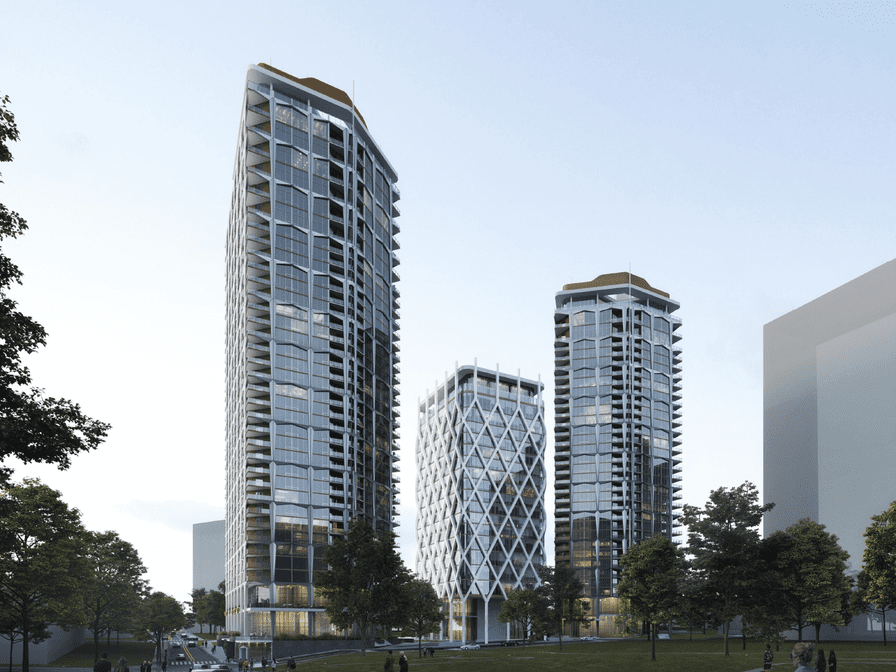 a group of tall buildings with trees and grass