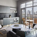 a living room with a kitchen and a table