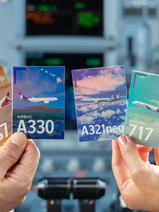 a group of hands holding up cards