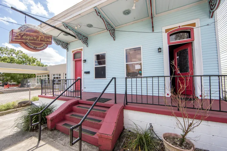 a building with stairs and a sign