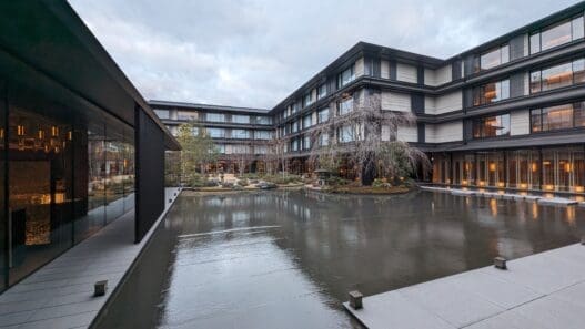 a building with a pond in front of it