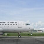 a white airplane on a runway