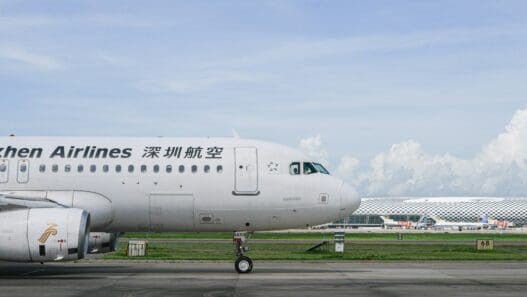 a white airplane on a runway