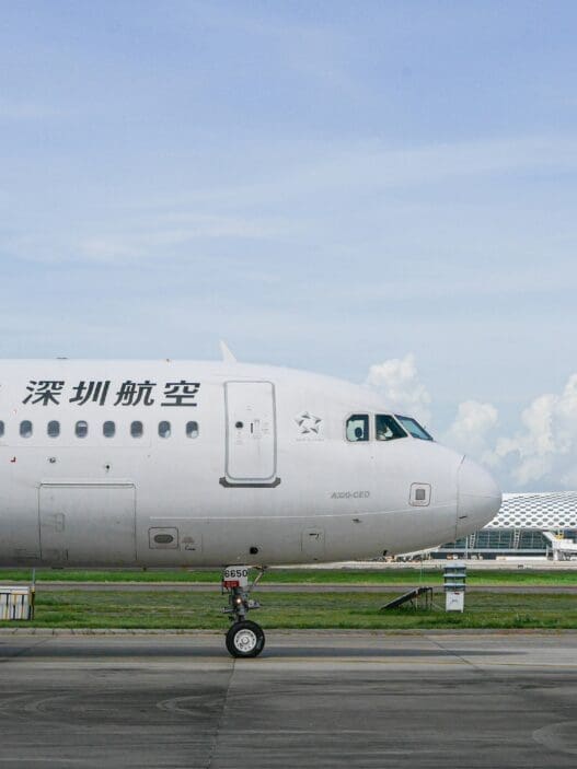 a white airplane on a runway