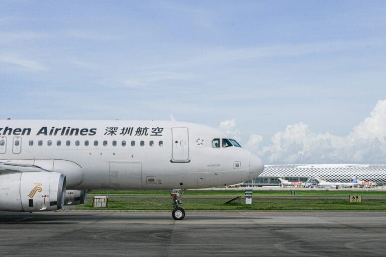 a white airplane on a runway
