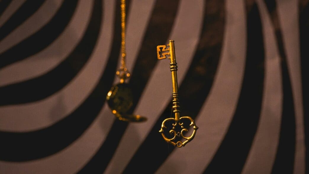 a gold key from a chain